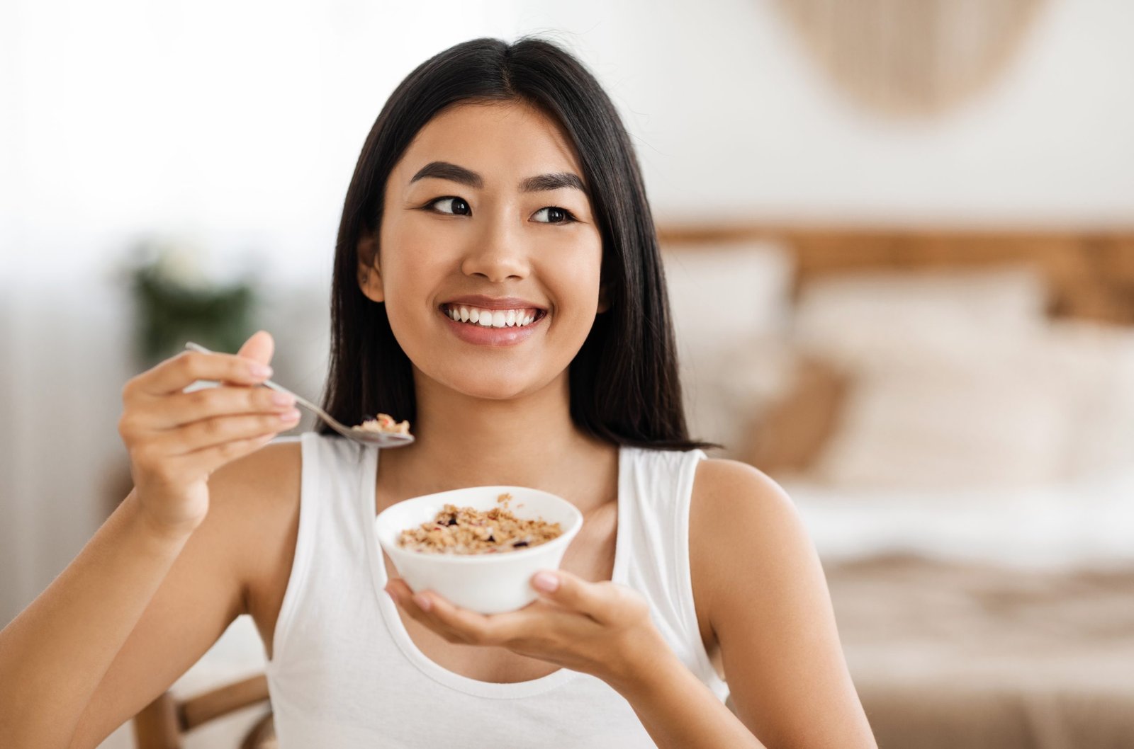 A woman holding a bowl of oatmeal